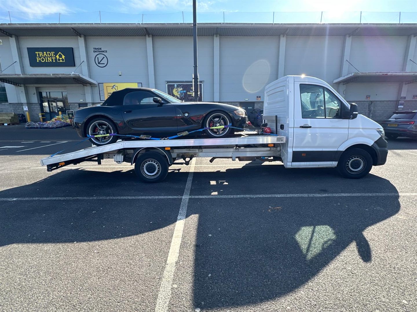 ZRG recovery truck transporting a BMW roadster